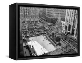With the Famed Rockefeller Center Christmas Tree Rising Above Them, Skaters Glide on the Ice-null-Framed Stretched Canvas