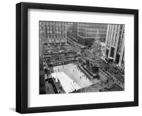 With the Famed Rockefeller Center Christmas Tree Rising Above Them, Skaters Glide on the Ice-null-Framed Photographic Print