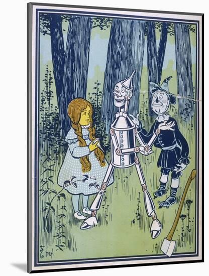 Wizard of Oz: Dorothy Oils the Tin Woodman's Joints-W.w. Denslow-Mounted Photographic Print