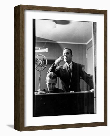 Wolfe, NBC Radio Director, Makes Timing Gestures Through the Glass Window of the Control Room-Alfred Eisenstaedt-Framed Photographic Print