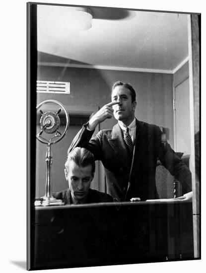 Wolfe, NBC Radio Director, Makes Timing Gestures Through the Glass Window of the Control Room-Alfred Eisenstaedt-Mounted Photographic Print
