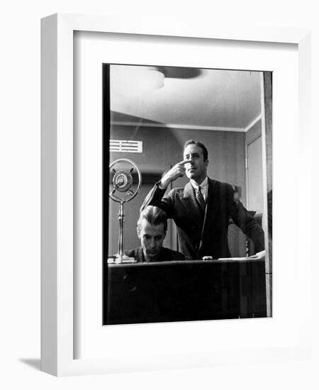 Wolfe, NBC Radio Director, Makes Timing Gestures Through the Glass Window of the Control Room-Alfred Eisenstaedt-Framed Photographic Print