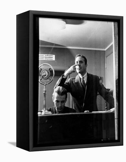 Wolfe, NBC Radio Director, Makes Timing Gestures Through the Glass Window of the Control Room-Alfred Eisenstaedt-Framed Stretched Canvas