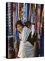 Woman and Baby, Cloth Shopkeeper in Temple Square, Bodhnath, Kathmandu, Nepal-Anthony Waltham-Stretched Canvas