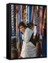 Woman and Baby, Cloth Shopkeeper in Temple Square, Bodhnath, Kathmandu, Nepal-Anthony Waltham-Framed Stretched Canvas