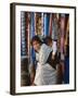 Woman and Baby, Cloth Shopkeeper in Temple Square, Bodhnath, Kathmandu, Nepal-Anthony Waltham-Framed Photographic Print