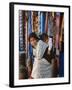 Woman and Baby, Cloth Shopkeeper in Temple Square, Bodhnath, Kathmandu, Nepal-Anthony Waltham-Framed Photographic Print