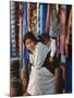 Woman and Baby, Cloth Shopkeeper in Temple Square, Bodhnath, Kathmandu, Nepal-Anthony Waltham-Mounted Photographic Print