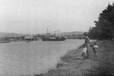 https://imgc.allpostersimages.com/img/posters/woman-and-children-watching-a-ship-at-waipu-wharf-c-1900_u-L-PPXRGK0.jpg?artPerspective=n
