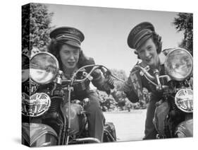 Woman and Her Daughter Sharing Interest in Motorcycle Racing-Sam Shere-Stretched Canvas