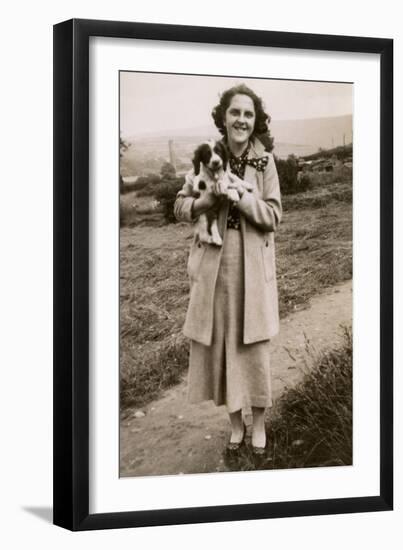 Woman and Puppy on a Hillside-null-Framed Photographic Print