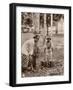 Woman and Young Boy Tap Rubber Trees in Malaya and Collect the Sap in Buckets-null-Framed Photographic Print