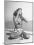 Woman Applying Suntan Lotion at the Beach-Peter Stackpole-Mounted Photographic Print