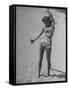 Woman Applying Suntan Lotion at the Beach-Peter Stackpole-Framed Stretched Canvas