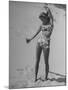 Woman Applying Suntan Lotion at the Beach-Peter Stackpole-Mounted Premium Photographic Print