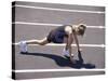 Woman at the Starting Pose on a Running Track-null-Stretched Canvas