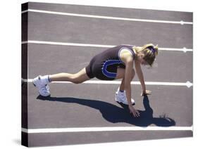 Woman at the Starting Pose on a Running Track-null-Stretched Canvas