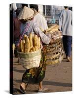 Woman Carrying Baskets of French Bread, Talaat Sao Market in Vientiane, Laos, Southeast Asia-Alain Evrard-Stretched Canvas