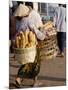 Woman Carrying Baskets of French Bread, Talaat Sao Market in Vientiane, Laos, Southeast Asia-Alain Evrard-Mounted Photographic Print