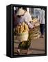Woman Carrying Baskets of French Bread, Talaat Sao Market in Vientiane, Laos, Southeast Asia-Alain Evrard-Framed Stretched Canvas