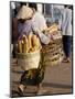 Woman Carrying Baskets of French Bread, Talaat Sao Market in Vientiane, Laos, Southeast Asia-Alain Evrard-Mounted Photographic Print