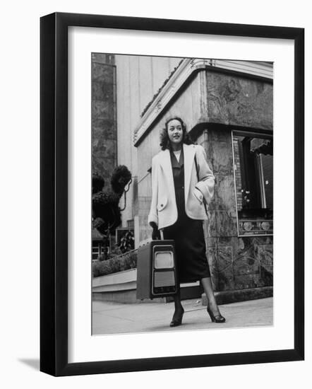Woman Carrying Portable Television Set Which Operates Indoors or Outdoors-George Skadding-Framed Photographic Print