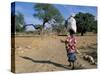 Woman Carrying Sack on Her Head, Ogol Village, Sangha, Dogon Area, Mali, Africa-Bruno Morandi-Stretched Canvas