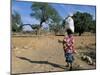 Woman Carrying Sack on Her Head, Ogol Village, Sangha, Dogon Area, Mali, Africa-Bruno Morandi-Mounted Photographic Print