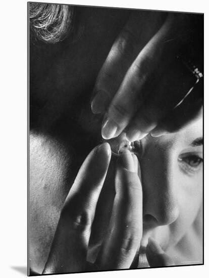 Woman Cautiously Placing a Contact Lens in Her Eye-Al Fenn-Mounted Photographic Print