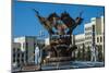 Woman Cleaning a Giant Bird Statue-Michael Runkel-Mounted Photographic Print