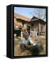 Woman Cleaning Pot Outside Her House, Near Siem Reap, Cambodia, Indochina, Southeast Asia-Jane Sweeney-Framed Stretched Canvas