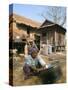 Woman Cleaning Pot Outside Her House, Near Siem Reap, Cambodia, Indochina, Southeast Asia-Jane Sweeney-Stretched Canvas