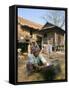 Woman Cleaning Pot Outside Her House, Near Siem Reap, Cambodia, Indochina, Southeast Asia-Jane Sweeney-Framed Stretched Canvas