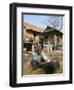 Woman Cleaning Pot Outside Her House, Near Siem Reap, Cambodia, Indochina, Southeast Asia-Jane Sweeney-Framed Photographic Print