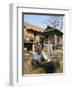 Woman Cleaning Pot Outside Her House, Near Siem Reap, Cambodia, Indochina, Southeast Asia-Jane Sweeney-Framed Photographic Print