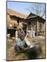 Woman Cleaning Pot Outside Her House, Near Siem Reap, Cambodia, Indochina, Southeast Asia-Jane Sweeney-Mounted Photographic Print