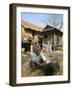 Woman Cleaning Pot Outside Her House, Near Siem Reap, Cambodia, Indochina, Southeast Asia-Jane Sweeney-Framed Photographic Print