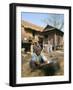 Woman Cleaning Pot Outside Her House, Near Siem Reap, Cambodia, Indochina, Southeast Asia-Jane Sweeney-Framed Photographic Print