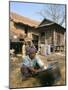 Woman Cleaning Pot Outside Her House, Near Siem Reap, Cambodia, Indochina, Southeast Asia-Jane Sweeney-Mounted Photographic Print