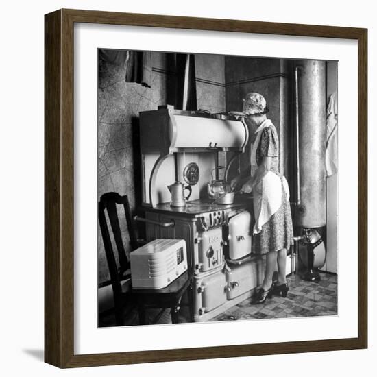 Woman Cooking on Old Fashioned Stove-Walter Sanders-Framed Photographic Print