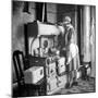 Woman Cooking on Old Fashioned Stove-Walter Sanders-Mounted Photographic Print