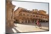 Woman Cycling Through Piazza Del Popolo, Ascoli Piceno, Le Marche, Italy-Ian Trower-Mounted Photographic Print