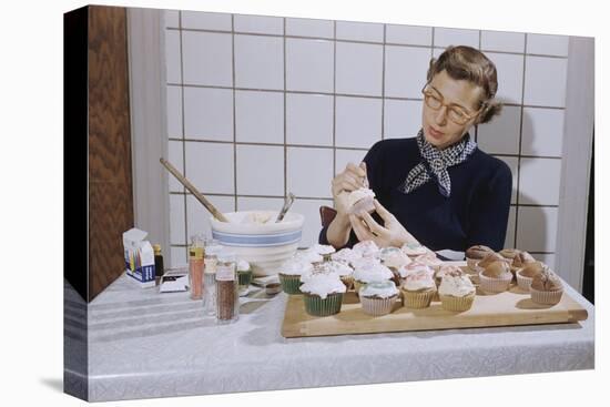 Woman Decorating Cup Cakes-William P. Gottlieb-Stretched Canvas