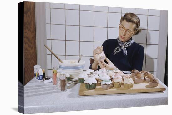 Woman Decorating Cup Cakes-William P. Gottlieb-Stretched Canvas