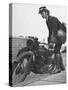 Woman Dispatch Rider Standing Beside Her Motorcycle-Hans Wild-Stretched Canvas