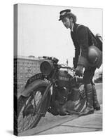 Woman Dispatch Rider Standing Beside Her Motorcycle-Hans Wild-Stretched Canvas