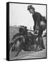 Woman Dispatch Rider Standing Beside Her Motorcycle-Hans Wild-Framed Stretched Canvas