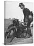 Woman Dispatch Rider Standing Beside Her Motorcycle-Hans Wild-Stretched Canvas