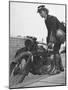 Woman Dispatch Rider Standing Beside Her Motorcycle-Hans Wild-Mounted Photographic Print