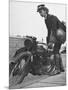 Woman Dispatch Rider Standing Beside Her Motorcycle-Hans Wild-Mounted Photographic Print